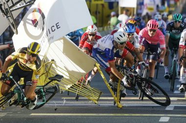 Dutch cyclist Dylan Groenewegen crashes to the ground as a bicycle is flying overhead in a major collision on the final stretch of the opening stage of the Tour de Pologne race in Katowice, Poland, on Wednesday, 05 August 2020.  The crash began with Groenewegen colliding with another Dutchman sprinting for the win, Fabio Jakobsen, who was hospitalized in serious condition and put into induced coma. Jakobsen was declared the winner and Groenewegen was disqualified.(AP Photo/Tomasz Markowski)