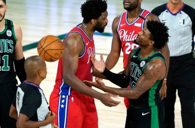Aug 17, 2020; Lake Buena Vista, Florida, USA; Philadelphia 76ers center Joel Embiid (21) exchanges words with Boston Celtics guard Marcus Smart (36) in the second half in game one of the first round of the 2020 NBA Playoffs at The Field House. Mandatory Credit: Ashley Landis/Pool Photo-USA TODAY Sports