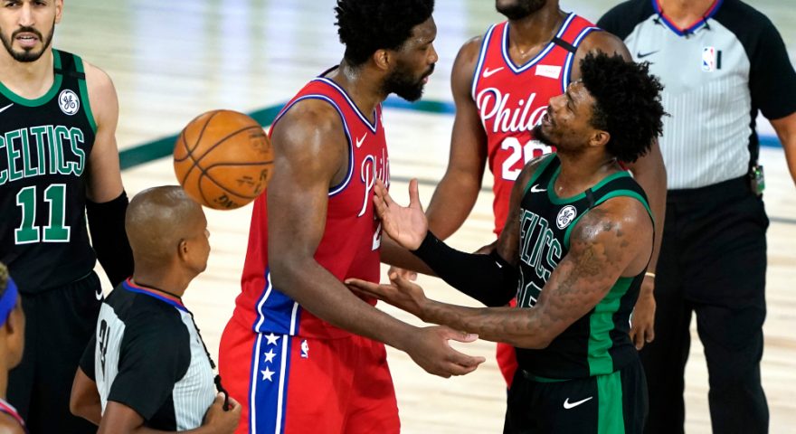 Aug 17, 2020; Lake Buena Vista, Florida, USA; Philadelphia 76ers center Joel Embiid (21) exchanges words with Boston Celtics guard Marcus Smart (36) in the second half in game one of the first round of the 2020 NBA Playoffs at The Field House. Mandatory Credit: Ashley Landis/Pool Photo-USA TODAY Sports