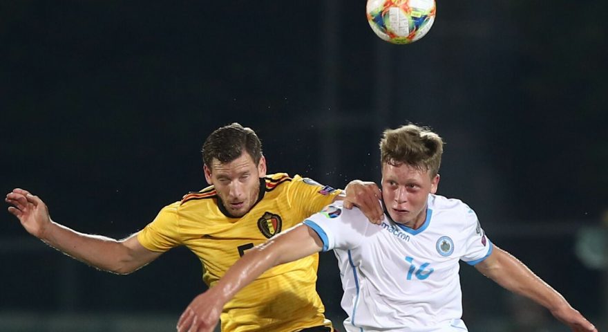 Belgium's defender Jan Vertonghen (L) and San Marino's forward Nicola Nanni go for a header during the Euro 2020 qualifier football match San Marino vs Belgium on September 6, 2019 at the Olympic stadium in Serravalle. (Photo by Isabella BONOTTO / AFP)